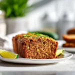 Close up of sliced apple zucchini bread with a tender moist crumb and sugar topping